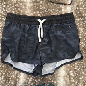 Black camo Vuori athletic shirt with built in undies in great conditon